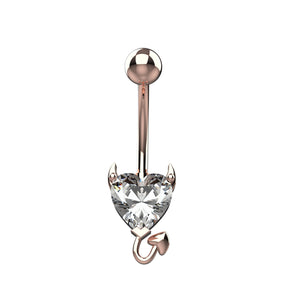 Rose gold belly ring with a clear devil heart-shaped gem