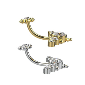 Gold and silver belly button ring with clear gemstones