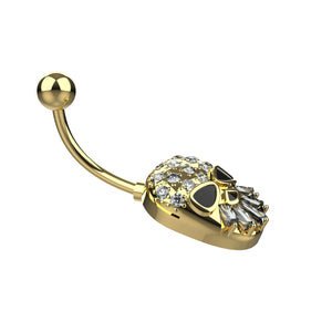 Gold skull-shaped belly button ring