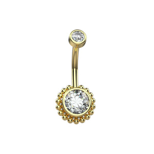 Gold belly button ring with clear gemstones