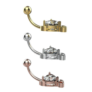 Three gold, silver, and rose gold belly rings with clear gemstones