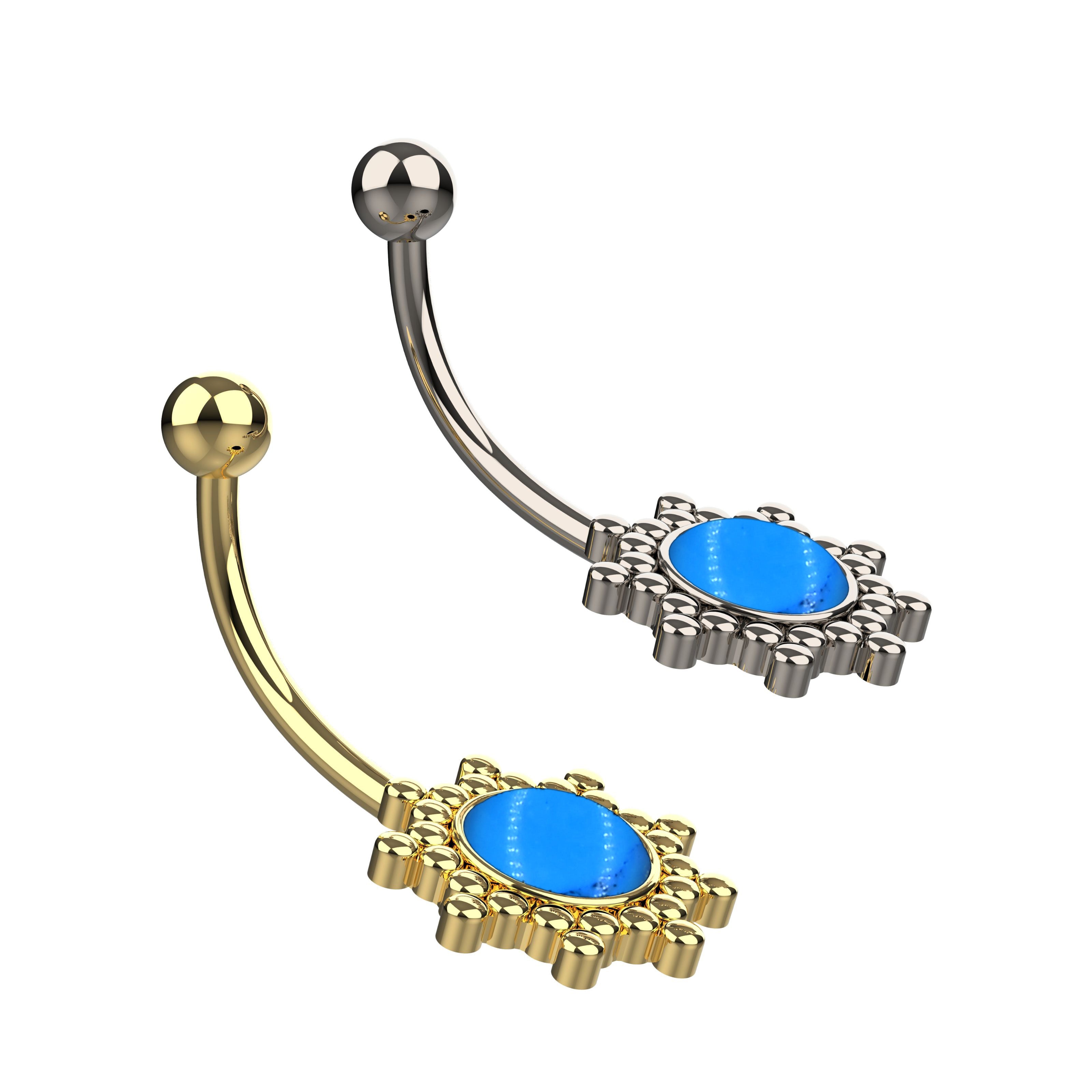 Belly button ring with blue gemstones and gold and silver accents 
