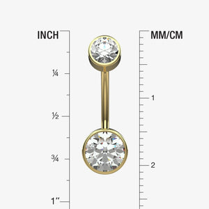 Gold belly button ring with clear gemstone on a measurement chart showing inches and millimeters.