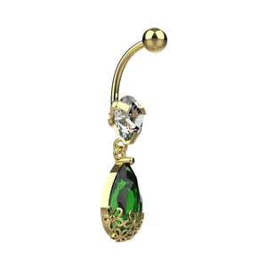 Decorative metal filigree flower cap around green crystal